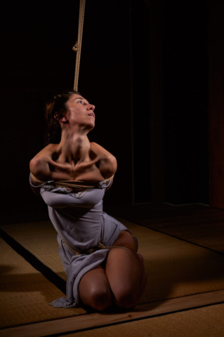 Pretty woman tied up in traditional Kinbaku Semenawa Shibari Rope Bondage.