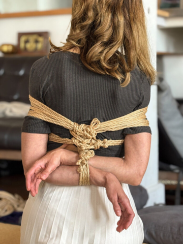 A man ties a woman, representation of sharing our approach to Gote (Box tie, Takate Kote) Shibari